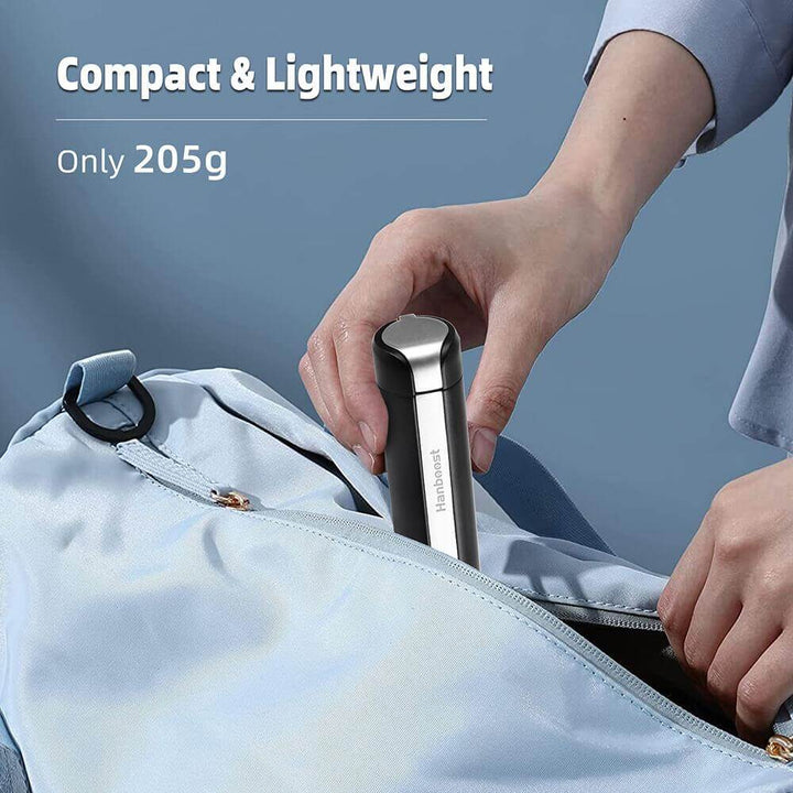 Person placing a compact silver item into a light blue bag with text highlighting 'Compact & Lightweight' and 'Only 205g'. Twotrees Hanboost C1 Ultrasonic Cutter for DIY Makers Precision Cutting Tool | Twotrees CNC Router Parts Accessories