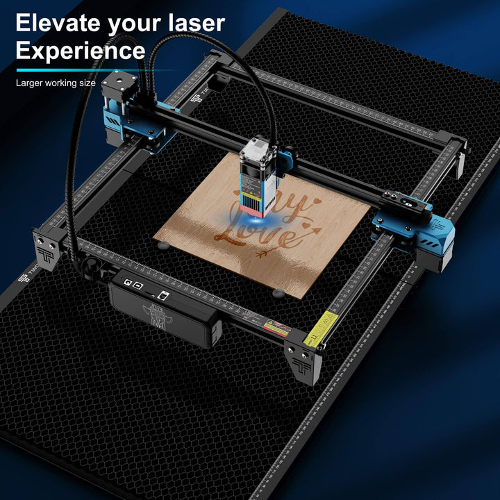 Laser engraving machine on a dark surface with 'My Love' engraving. Twotrees Spliced Honeycomb Panel Workbench 500x500x22mm for Laser Engraving | Twotrees Laser Engraver Parts Accessories