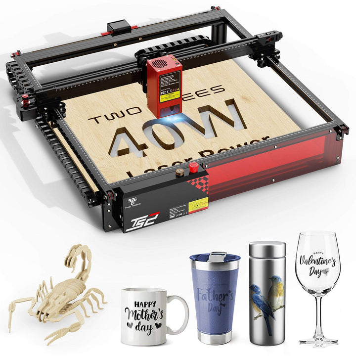 Laser engraving machine on a white background with engraved items like mugs, tumblers, and a wine glass. Twotrees TS2 40W Laser Engraver Precision Engraving and Cutting Machine | Twotrees Laser Engraver