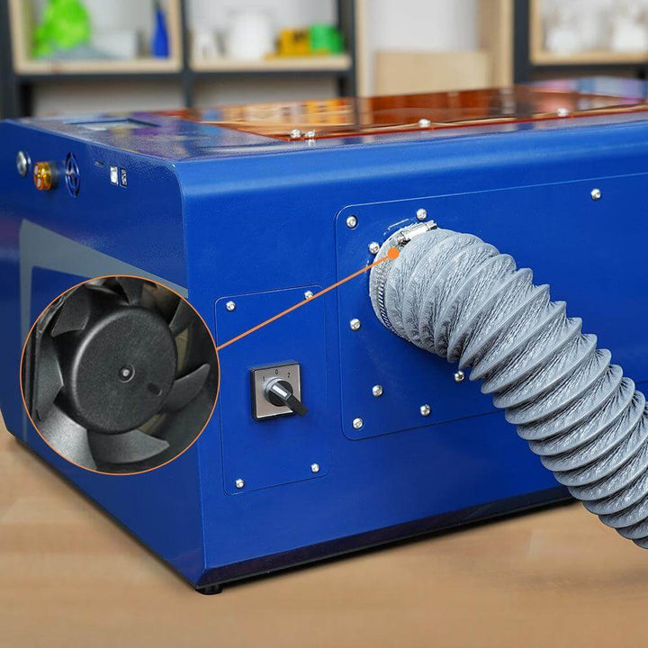 Blue machine with a gray hose and fan detail on a wooden surface Twotrees TS3 10W Black Enclosed Diode Laser Engraver - High Precision & Safety | Twotrees Laser Engraver