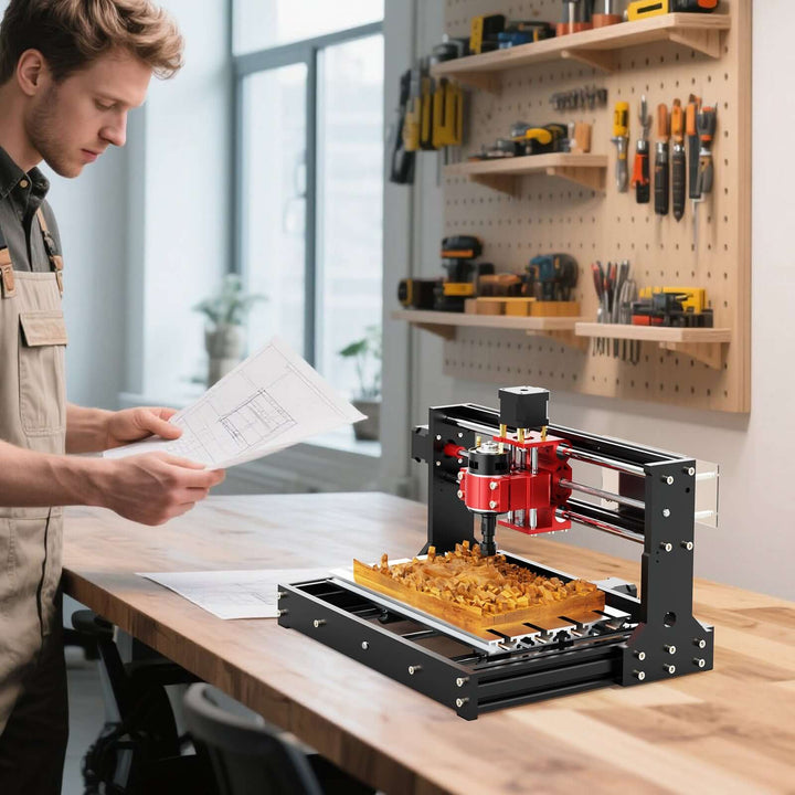 Man working with a 3D printer in a workshop setting Twotrees TTC3018 Pro Advanced CNC Router Machine | Twotrees CNC Router