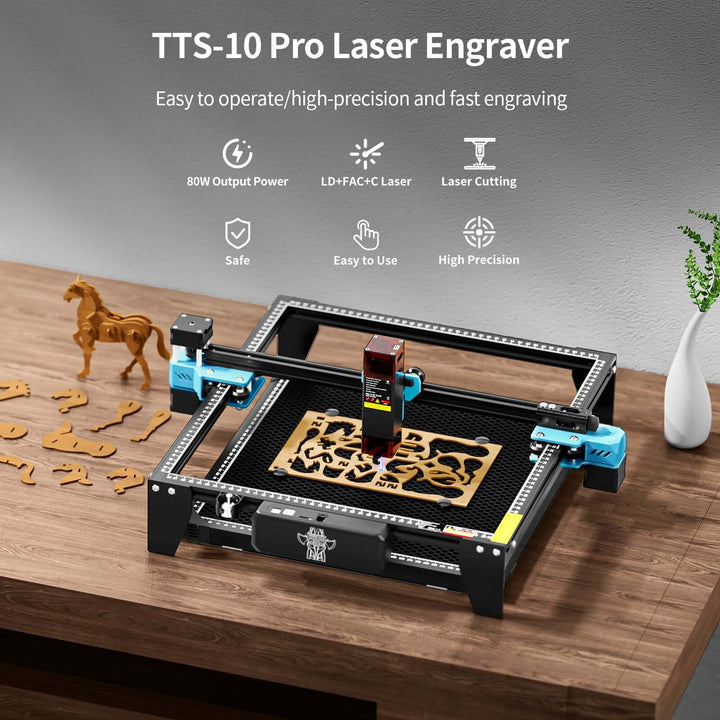 TTS-10 Pro Laser Engraver on a wooden table with decorative items. Twotrees TTS-10 Pro Diode Laser Engraver High Precision Engraving and Cutting | Twotrees Laser Engraver